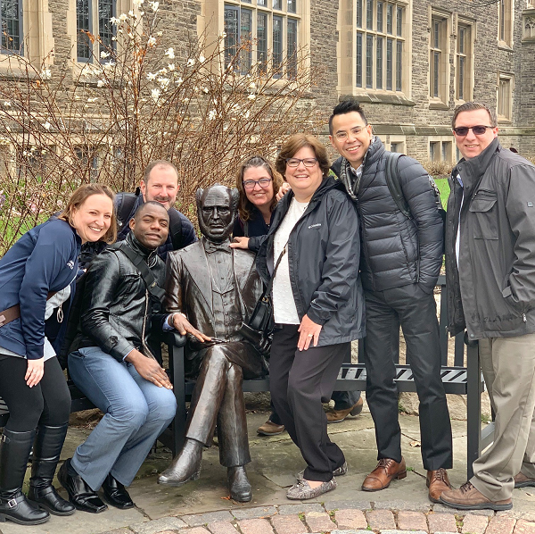 A group of Drexel DNP students poses with a statue of William McMaster. (Photo credit: Christopher Acebedo)